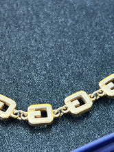 Collier ras-de-cou Givenchy plaqué or authentifié — Le Comptoir Vintage