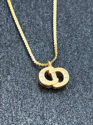 Dior collier CD plaqué or  authentifié — Le comptoir vintage