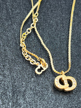 Collier Dior CD plaqué or authentifié — Le Comptoir Vintage