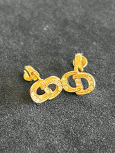 Boucles d'oreilles Dior clip logo CD strass authentifiées — Le Comptoir Vintage