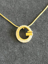 Collier Givenchy pendentif cercle pavé de strass authentifié — Le Comptoir Vintage